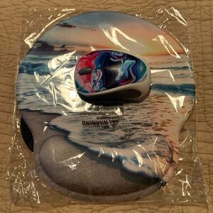 Wireless mouse and mousepad. New in package.